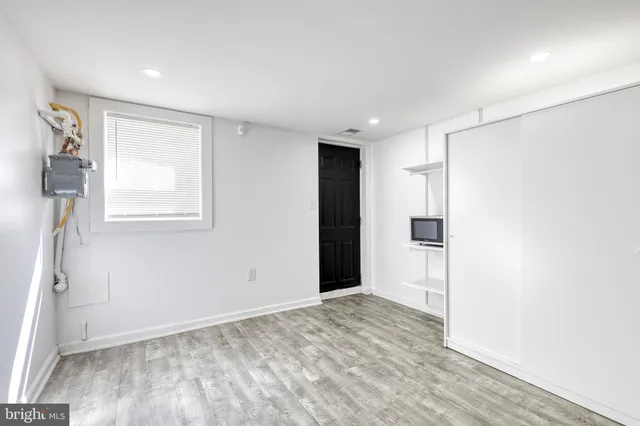 a view of an empty room with a window