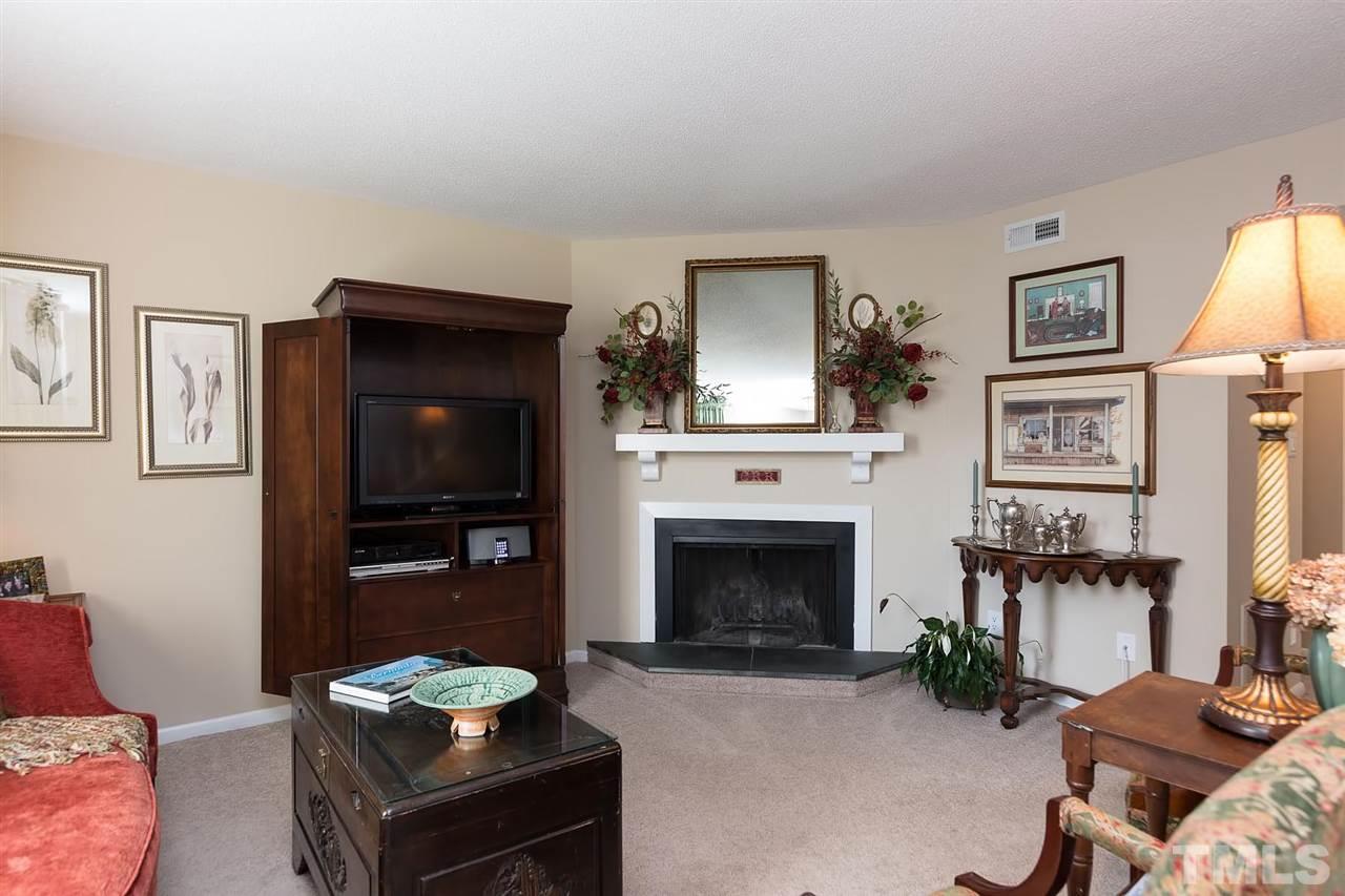 5845 Shady Grove Circle Raleigh, NC 27609 - Photo 2 of 16 a living room with furniture and a fireplace