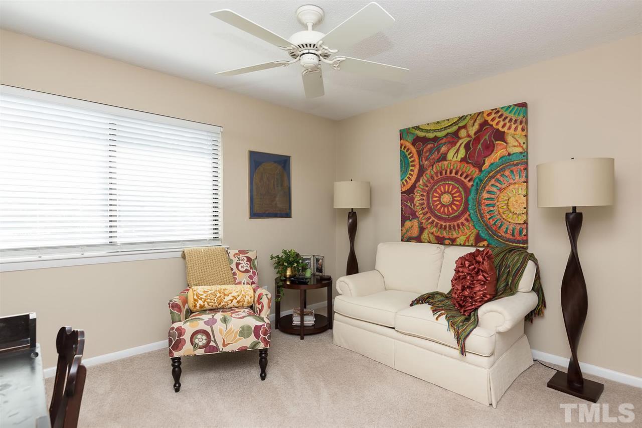 5845 Shady Grove Circle Raleigh, NC 27609 - Photo 12 of 16 a living room with furniture and a window