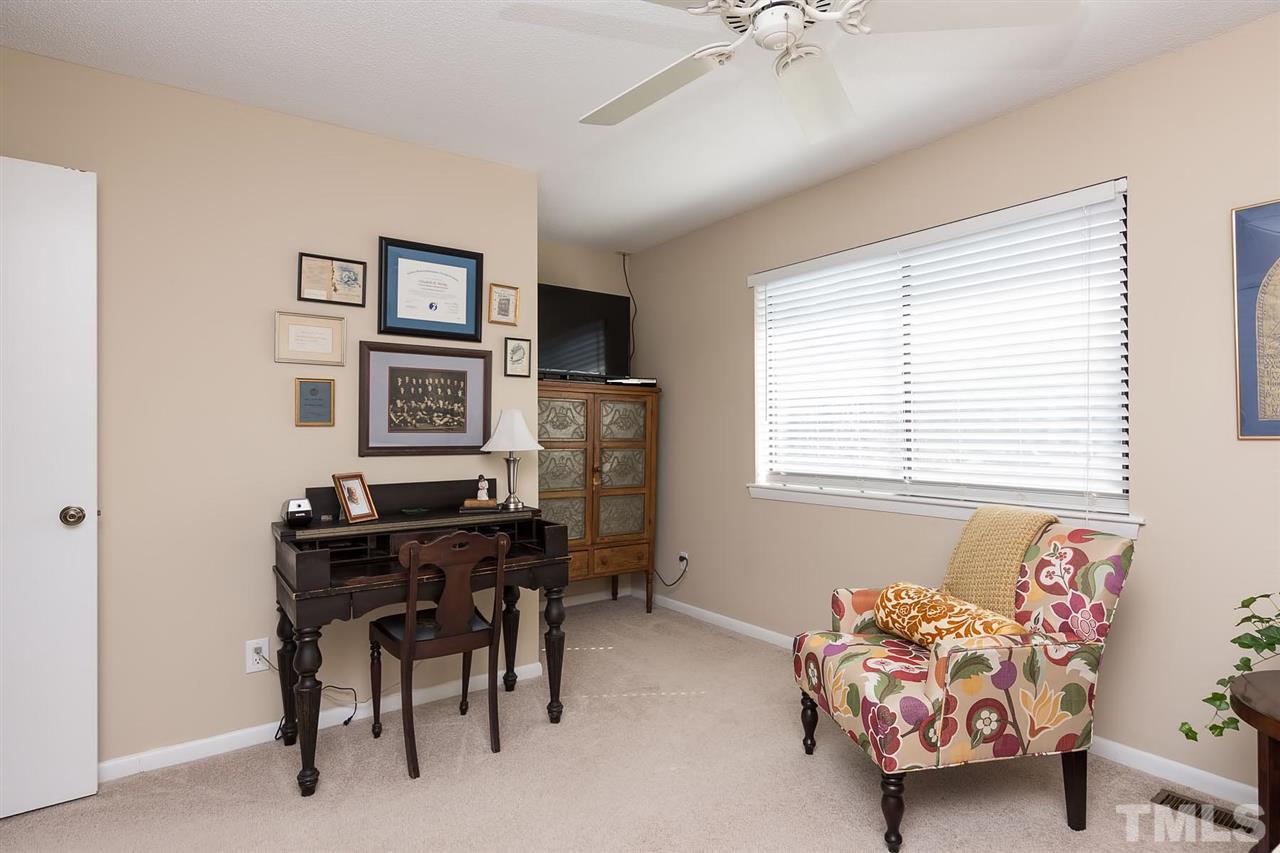 5845 Shady Grove Circle Raleigh, NC 27609 - Photo 13 of 16 a bedroom with furniture and a window