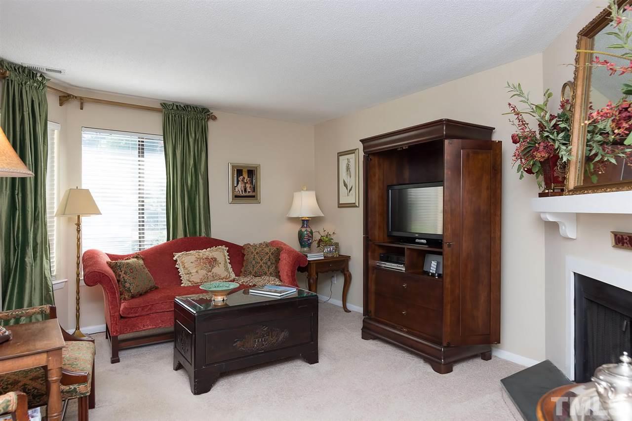 5845 Shady Grove Circle Raleigh, NC 27609 - Photo 3 of 16 a living room with furniture and a flat screen tv