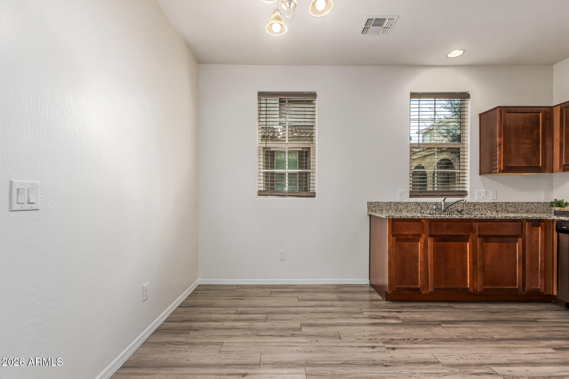 5446 Fulton Street Phoenix, AZ 85043 - Photo 11 of 42 a bathroom with a granite countertop sink and mirror