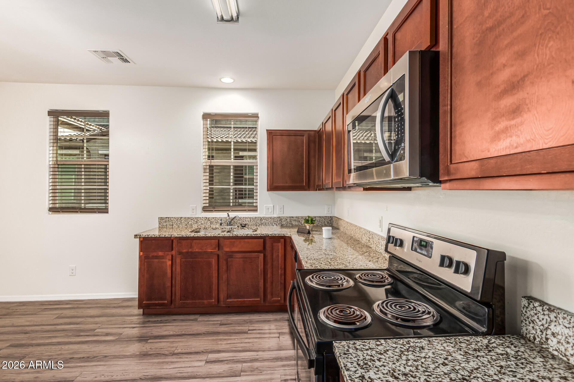 5446 Fulton Street Phoenix, AZ 85043 - Photo 12 of 42 a kitchen with a stove and a sink