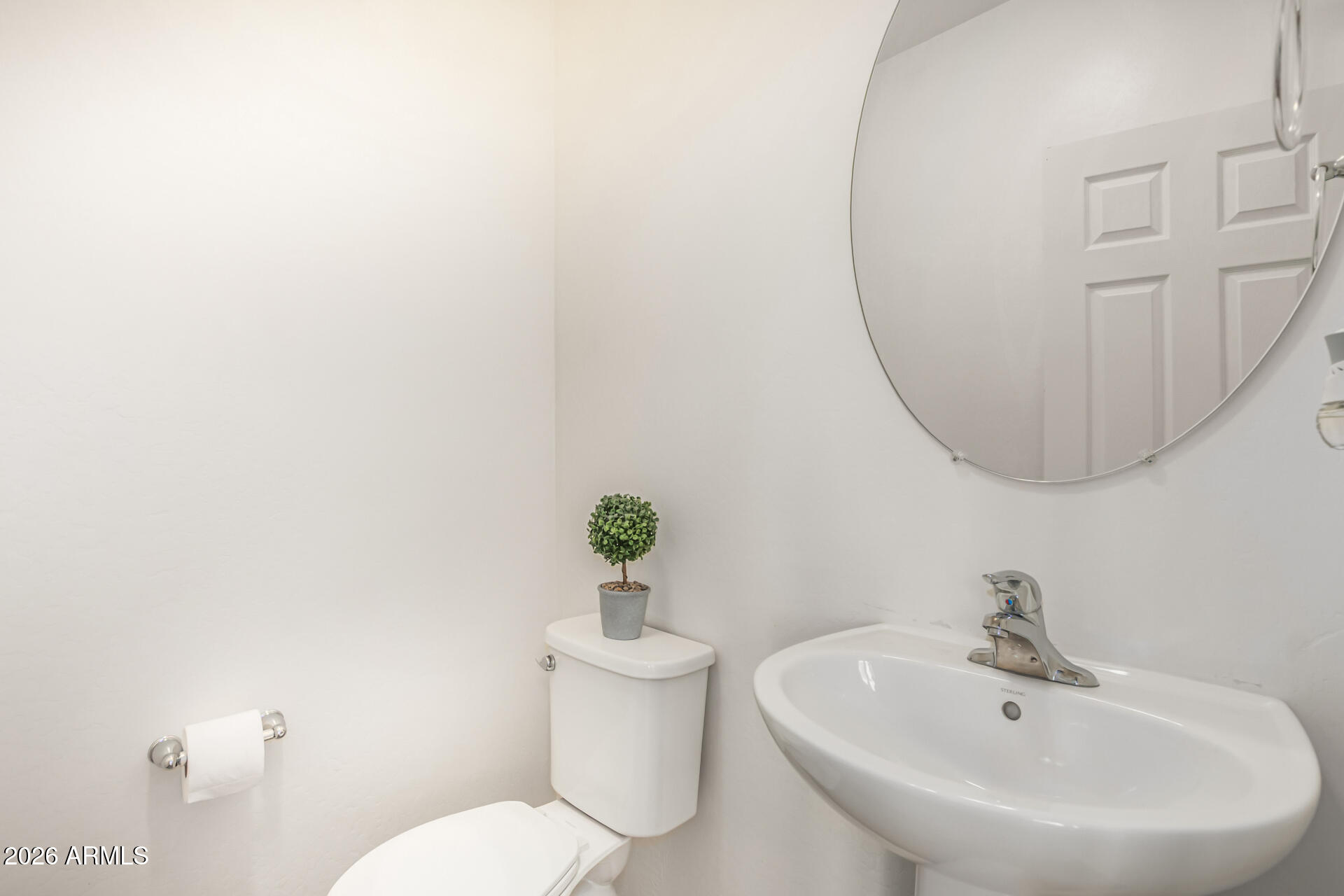 5446 Fulton Street Phoenix, AZ 85043 - Photo 17 of 42 a bathroom with a sink mirror and toilet