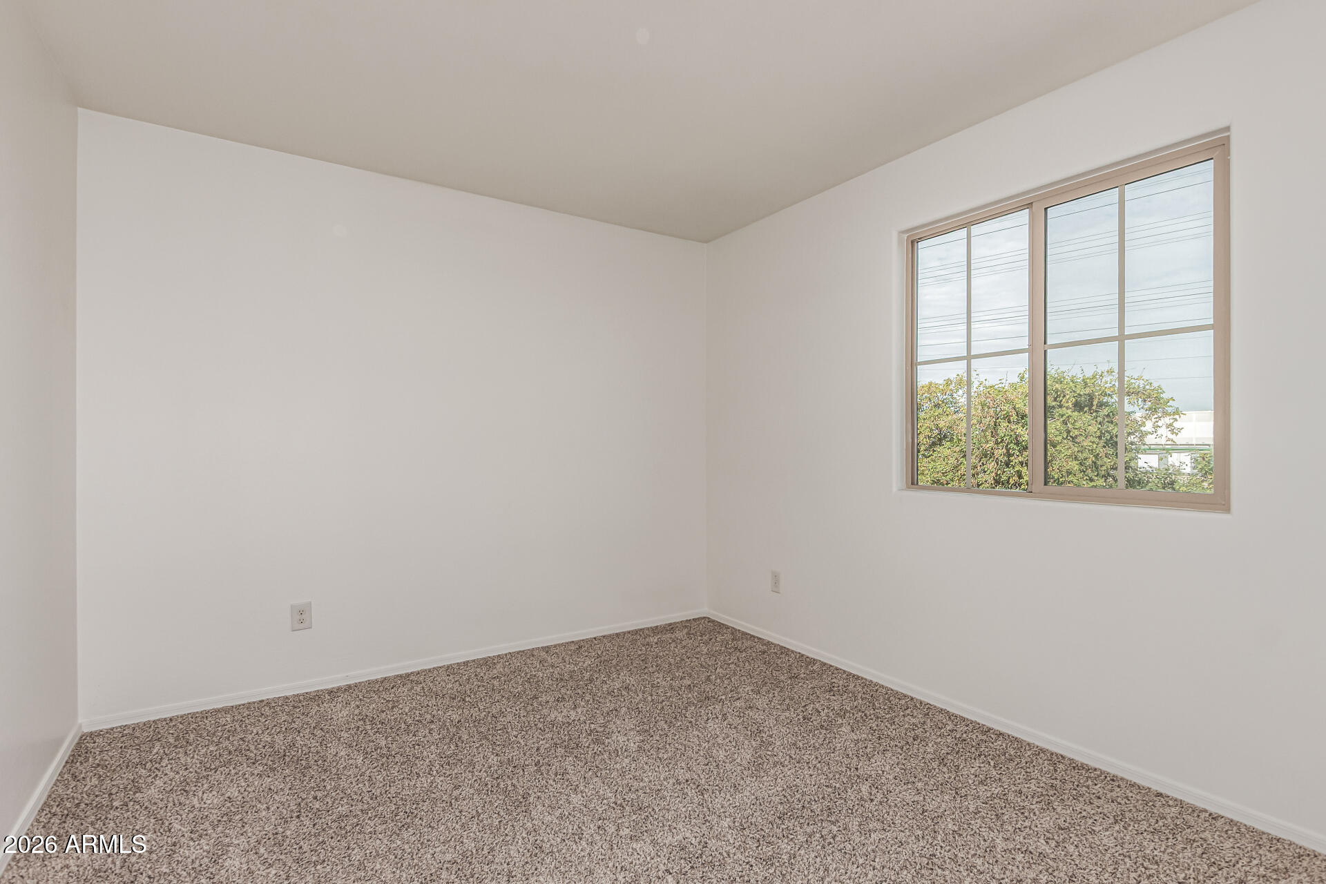 5446 Fulton Street Phoenix, AZ 85043 - Photo 24 of 42 an empty room with a window