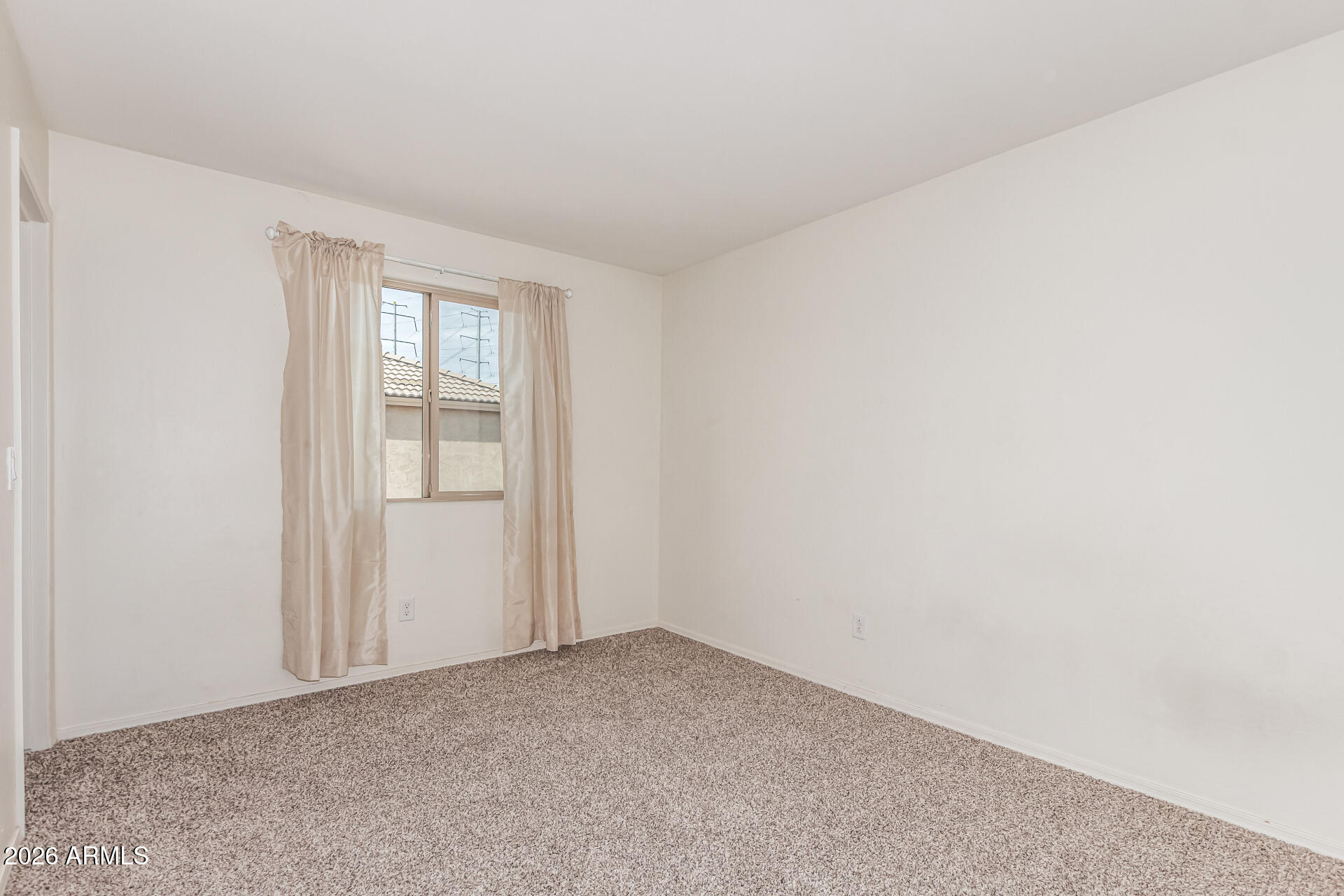 5446 Fulton Street Phoenix, AZ 85043 - Photo 26 of 42 a view of an empty room and window