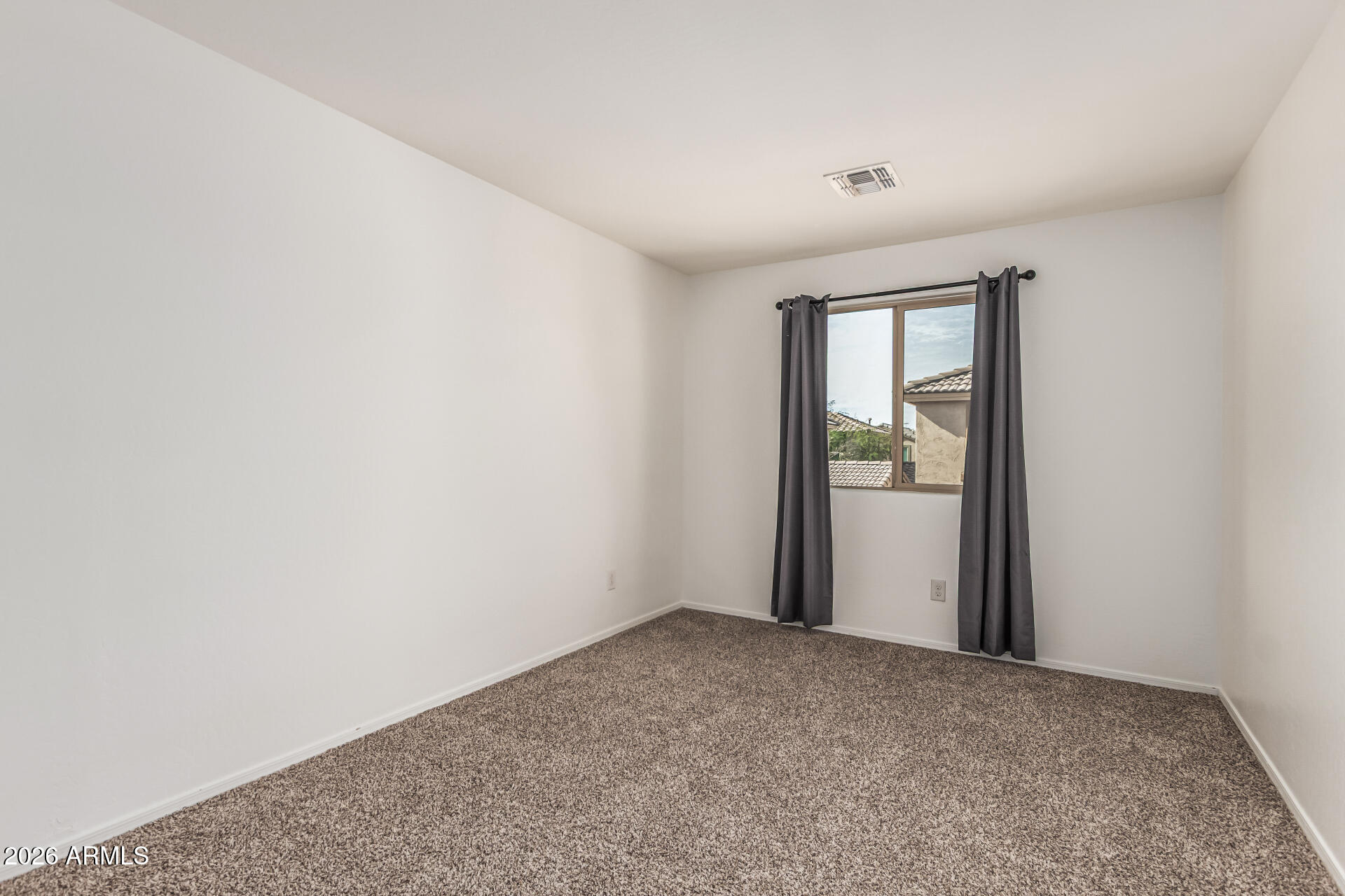 5446 Fulton Street Phoenix, AZ 85043 - Photo 29 of 42 a view of an empty room and window