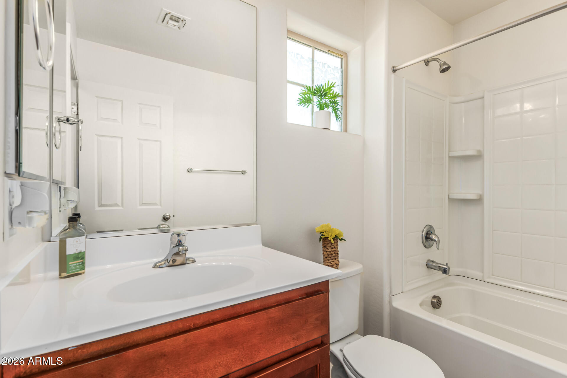 5446 Fulton Street Phoenix, AZ 85043 - Photo 31 of 42 a bathroom with a sink and a mirror