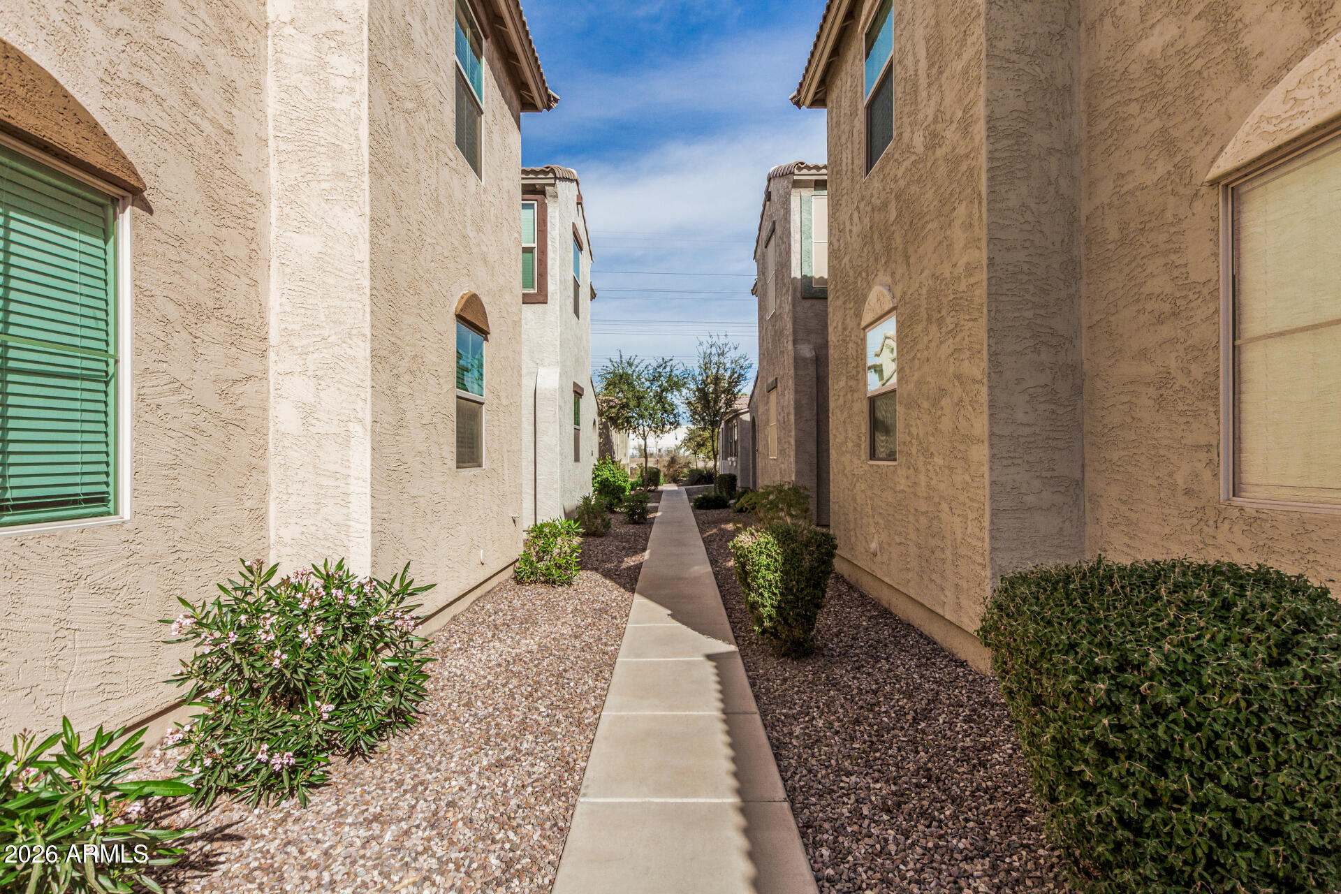 5446 Fulton Street Phoenix, AZ 85043 - Photo 5 of 42 a view of a pathway along with potted plants