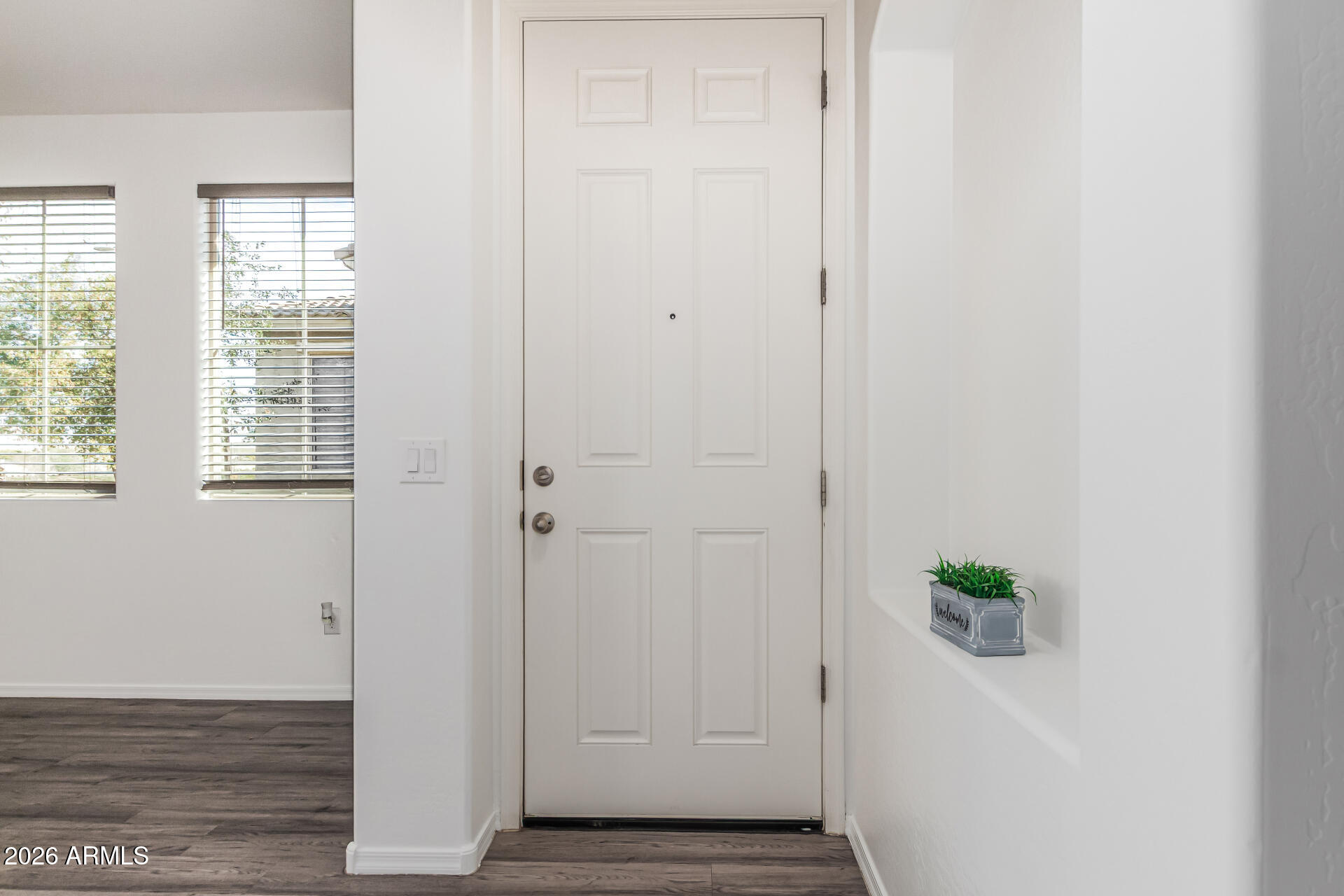5446 Fulton Street Phoenix, AZ 85043 - Photo 6 of 42 a view of an entryway with wooden floor