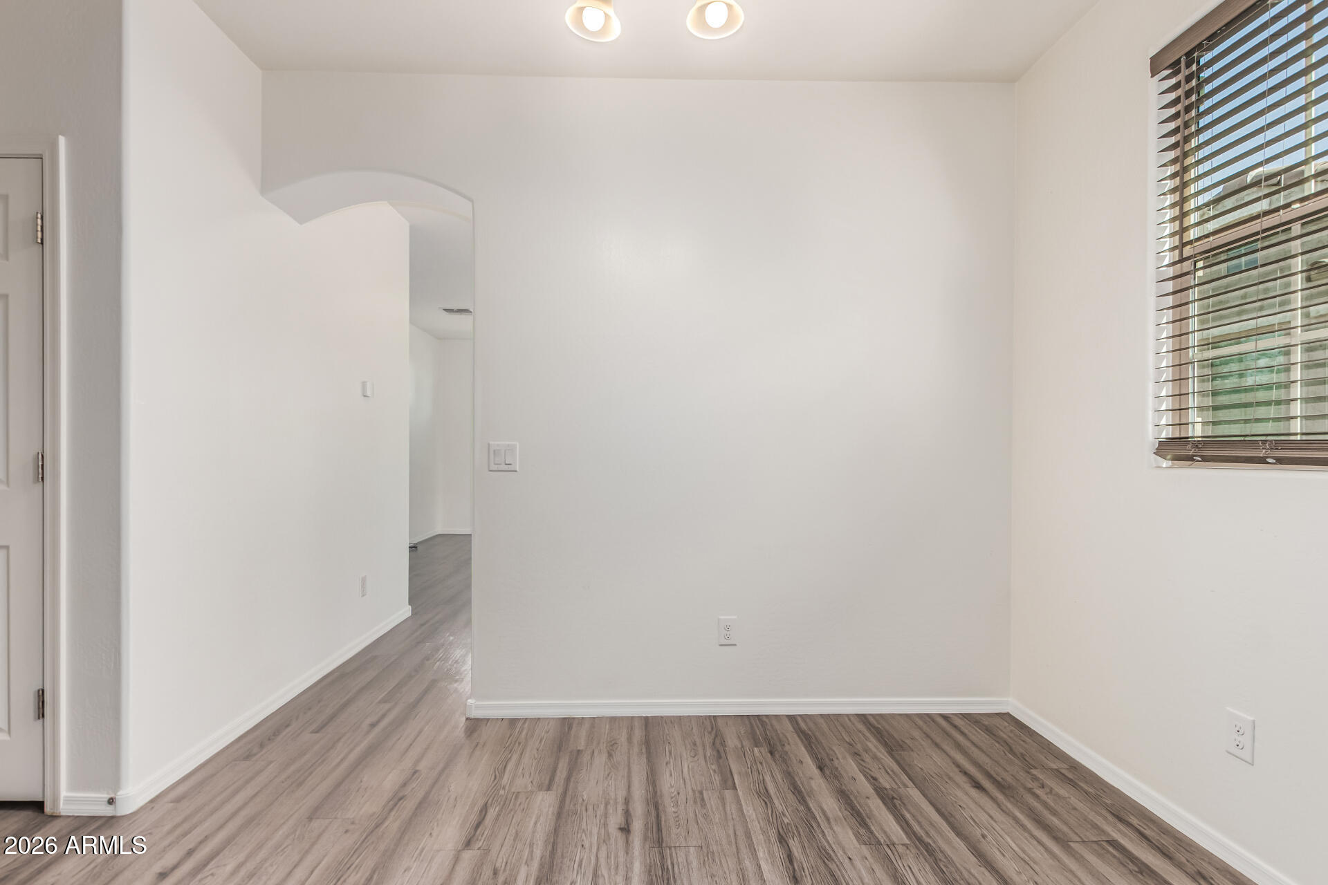 5446 Fulton Street Phoenix, AZ 85043 - Photo 10 of 42 a view of a room with wooden floor