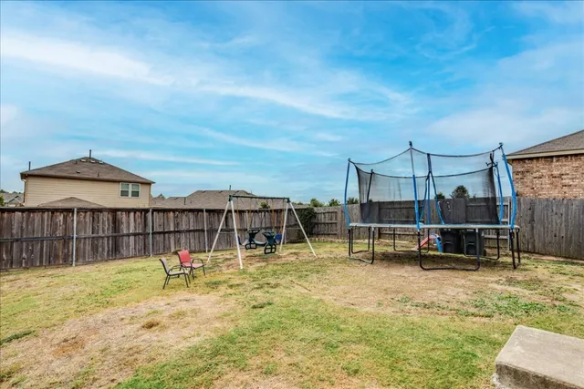 a swimming pool with lawn chairs