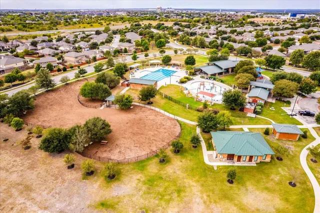 an aerial view of a swimming pool and outdoor space