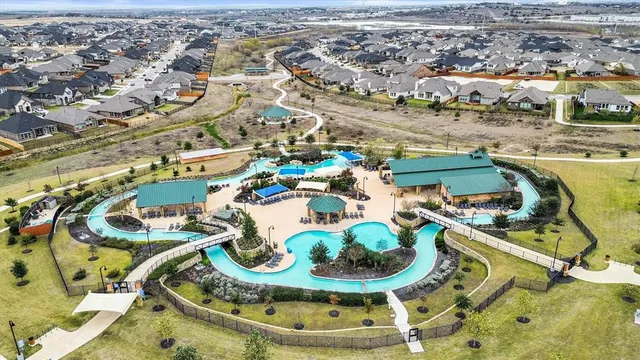 a building outdoor space with patio furniture and potted plants