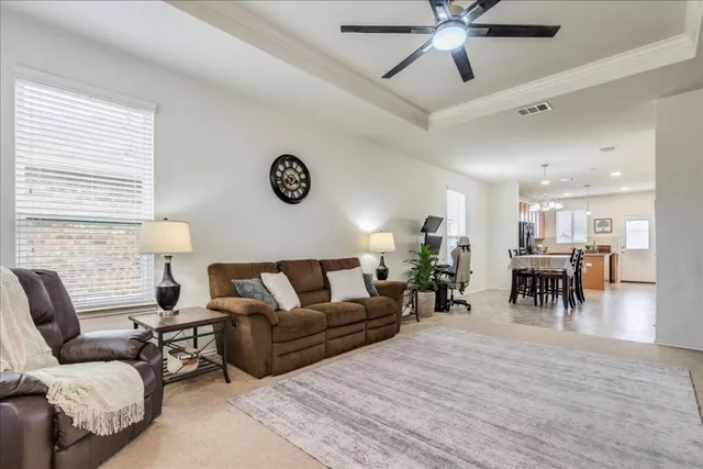 a living room with furniture and a table