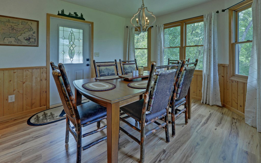 445 Tranquil Cove Road Murphy, NC 28906 - Photo 17 of 77 a view of a dining room with furniture window and wooden floor