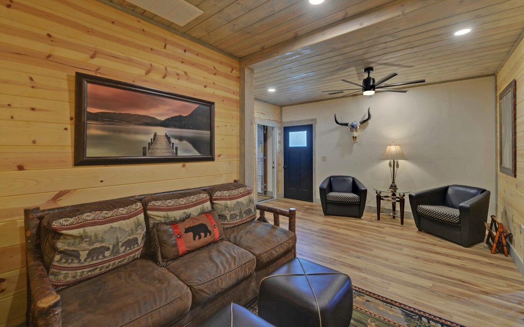 445 Tranquil Cove Road Murphy, NC 28906 - Photo 40 of 77 a living room with furniture and a wooden floor