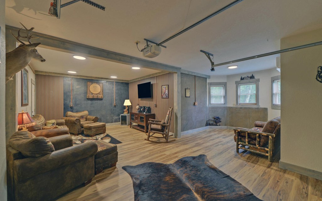 445 Tranquil Cove Road Murphy, NC 28906 - Photo 41 of 77 a living room with furniture and wooden floor