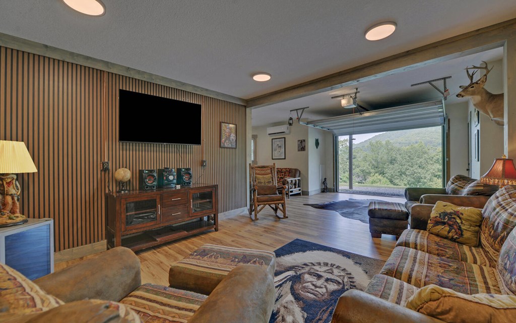 445 Tranquil Cove Road Murphy, NC 28906 - Photo 42 of 77 a living room with furniture and a flat screen tv