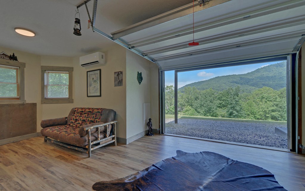 445 Tranquil Cove Road Murphy, NC 28906 - Photo 45 of 77 a living room with furniture and a large window