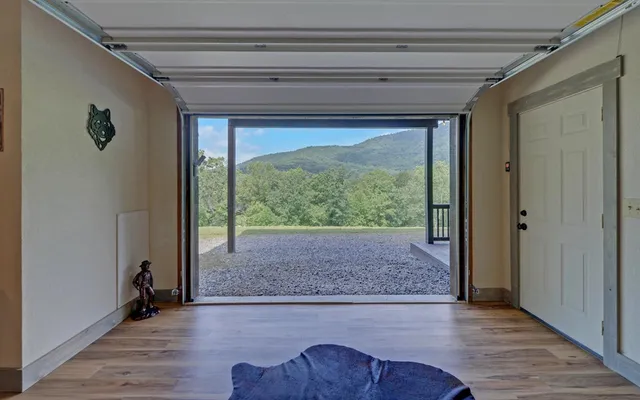 a view of a big yard with lots of green space