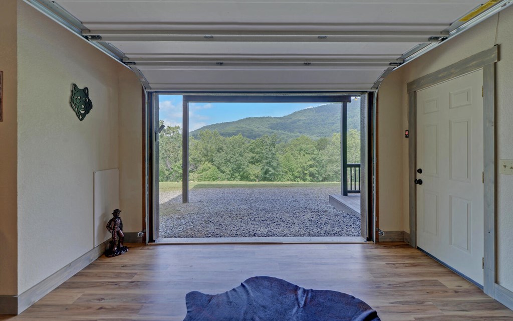 445 Tranquil Cove Road Murphy, NC 28906 - Photo 46 of 77 a view of empty room with wooden floor and fan