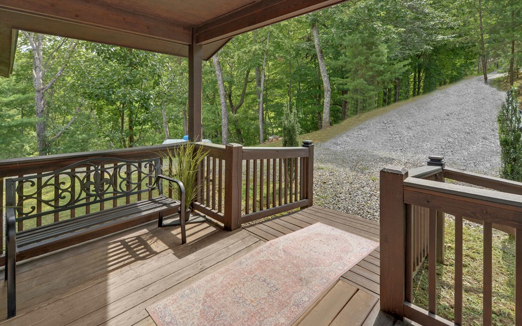 445 Tranquil Cove Road Murphy, NC 28906 - Photo 6 of 77 a view of a roof deck with wooden floor and fence