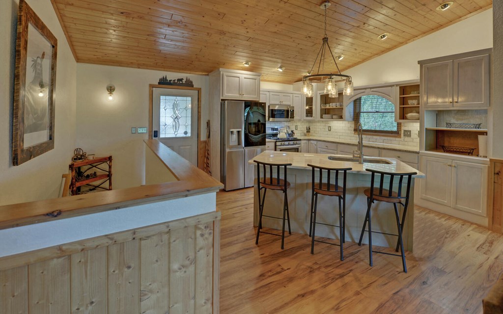 445 Tranquil Cove Road Murphy, NC 28906 - Photo 7 of 77 a view of a dining area with furniture and wooden floor