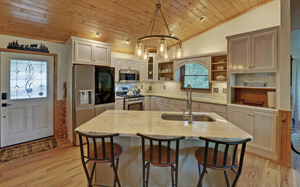 445 Tranquil Cove Road Murphy, NC 28906 - Photo 8 of 77 a view of a dining room with furniture and wooden floor
