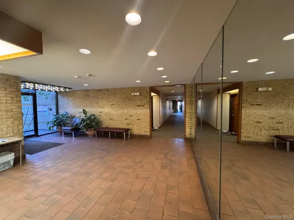a lobby with furniture and a table