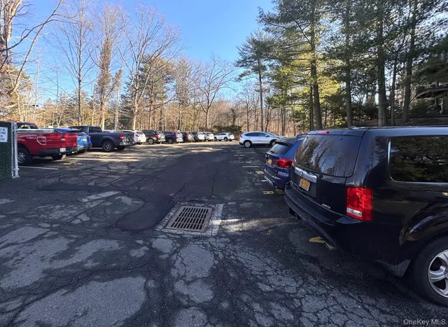 a view of a brick building next to a yard
