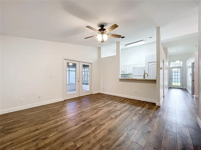 a bathroom with a granite countertop sink a toilet and a mirror