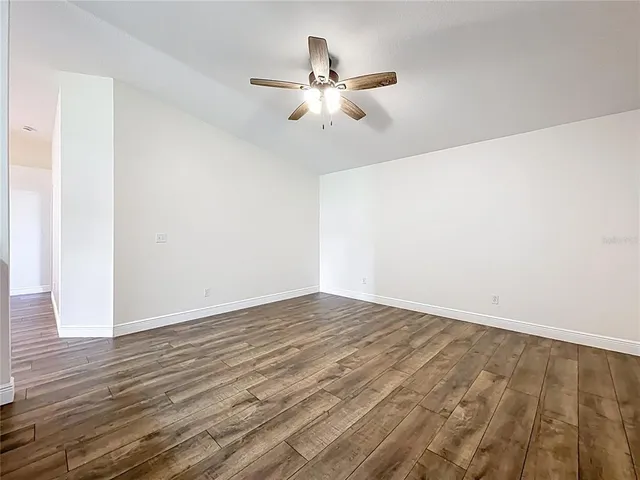 a bathroom with a granite countertop sink a mirror and vanity