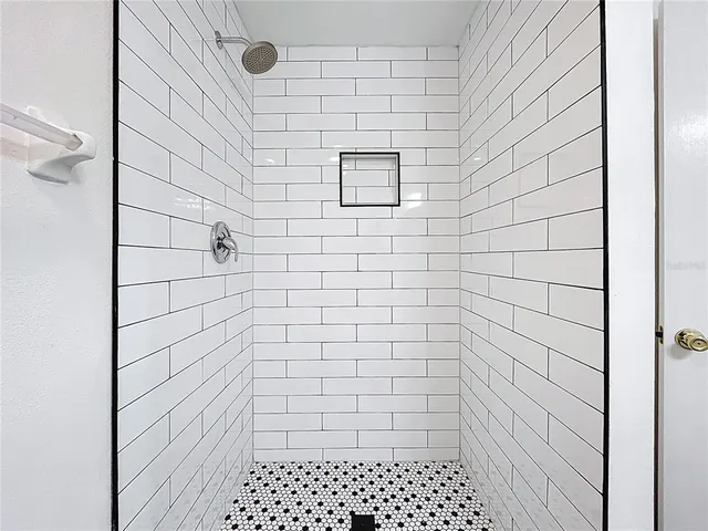 a view of an empty room with windows