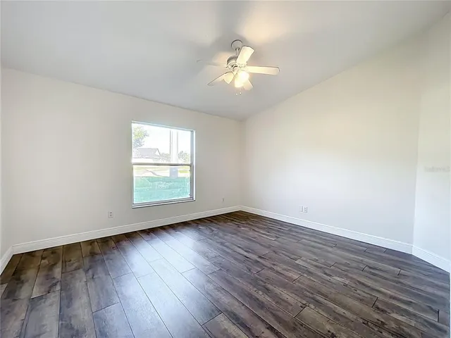a view of an empty room with a large window
