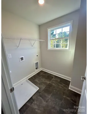 an empty room with an empty space and window