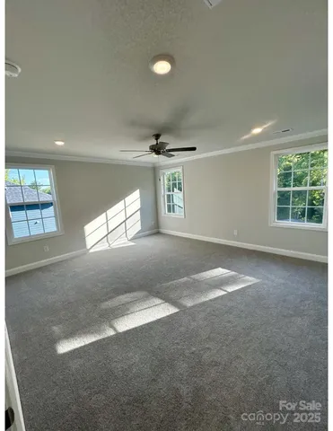 a view of empty room with windows