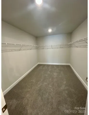 an empty room with shelves