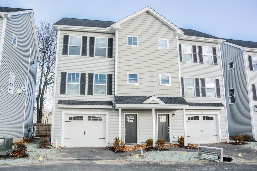 1400 Gorham Street, Unit 40 Lowell, MA 01852 - Photo 1 of 19 a front view of a house with a garage