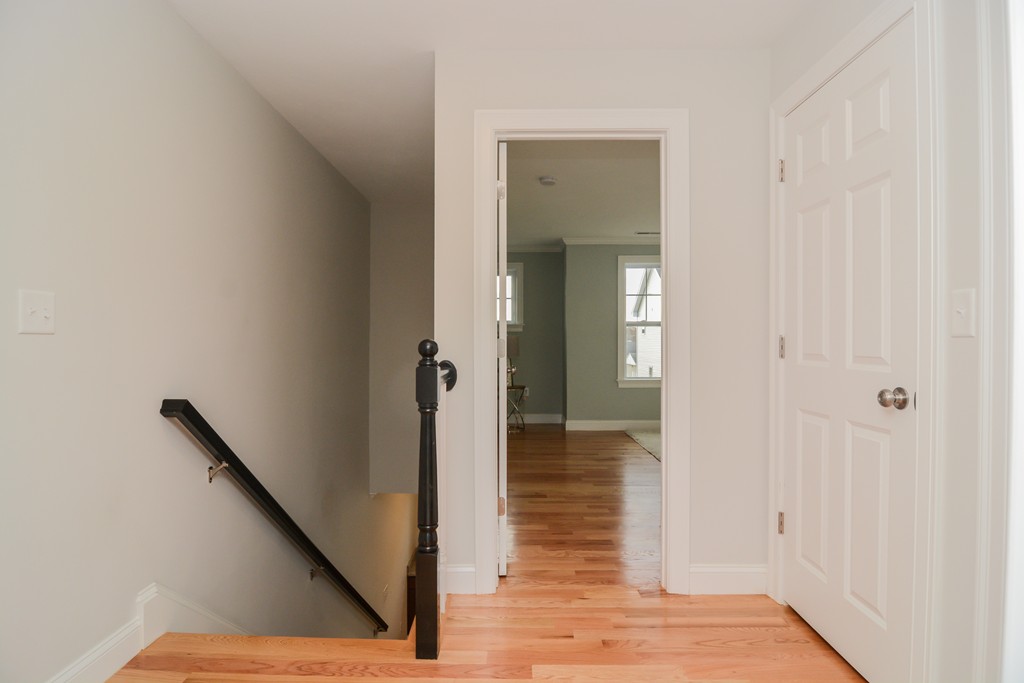 1400 Gorham Street, Unit 40 Lowell, MA 01852 - Photo 12 of 19 a view of a hallway with wooden floor and closet