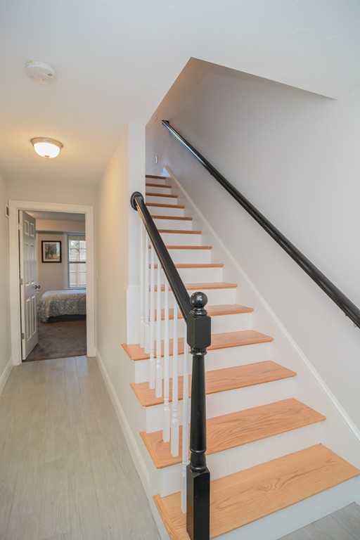 1400 Gorham Street, Unit 40 Lowell, MA 01852 - Photo 3 of 19 a view of staircase with white walls and railing