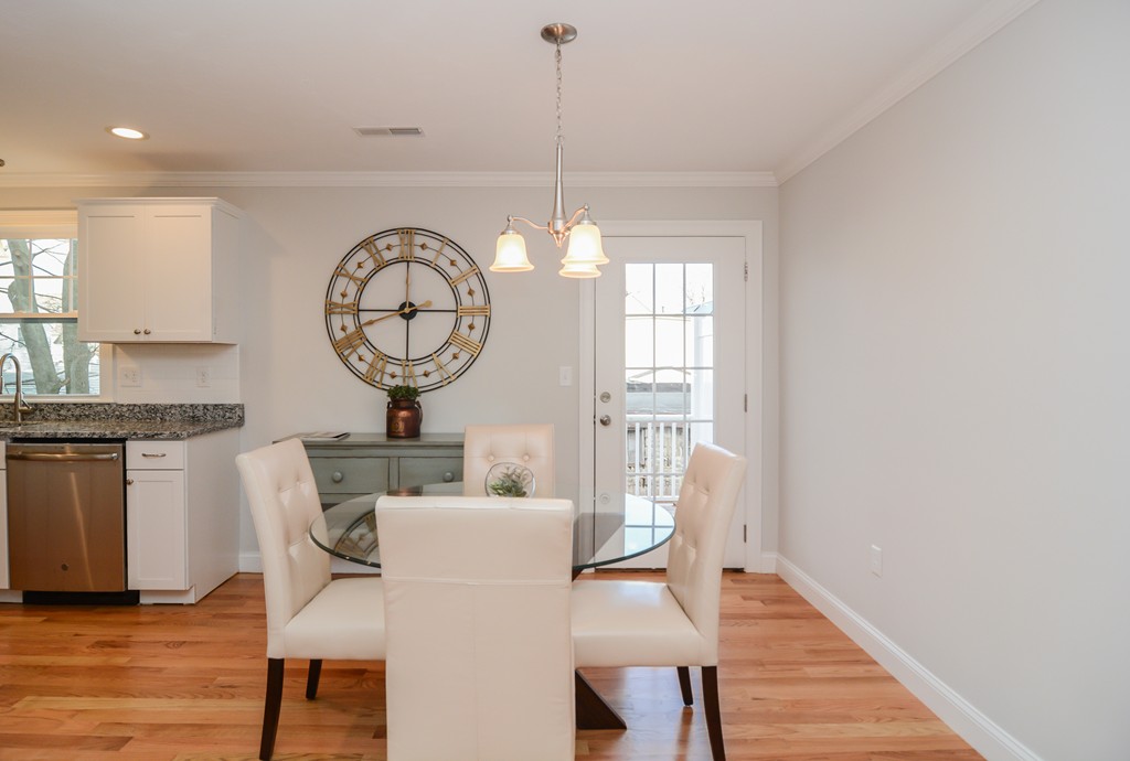 1400 Gorham Street, Unit 40 Lowell, MA 01852 - Photo 6 of 19 a view of a dining room with furniture window and wooden floor