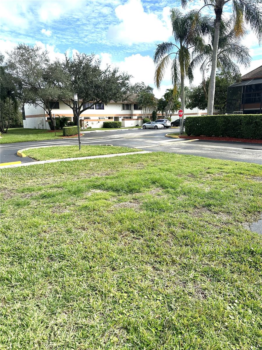4220 Southwest 71st Terrace Davie, FL 33314 - Photo 3 of 16 a view of yard with swimming pool and trees