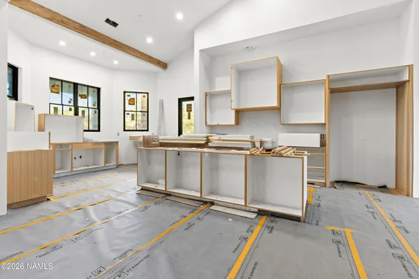 a view of kitchen with stainless steel appliances granite countertop a stove top oven a sink a counter space and cabinets
