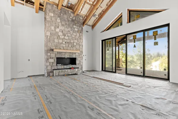 a view of an front door and a fireplace