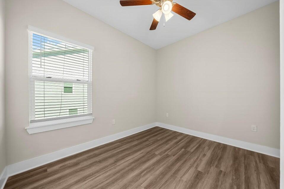 314 Date Palm Lane, Unit HORIZON Freeport, FL 32439 - Photo 16 of 25 wooden floor in an empty room with a window
