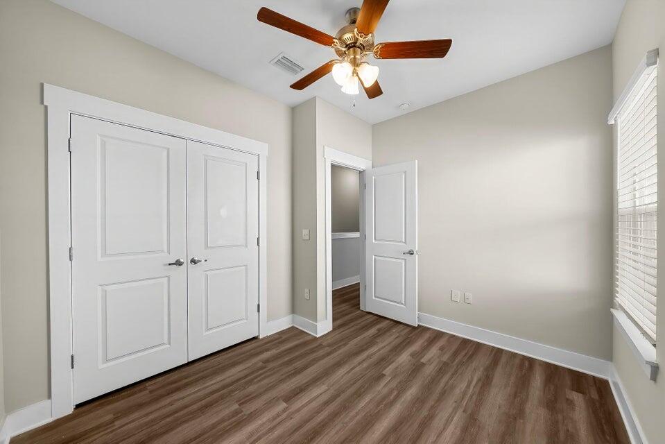 314 Date Palm Lane, Unit HORIZON Freeport, FL 32439 - Photo 17 of 25 wooden floor in an empty room with a window