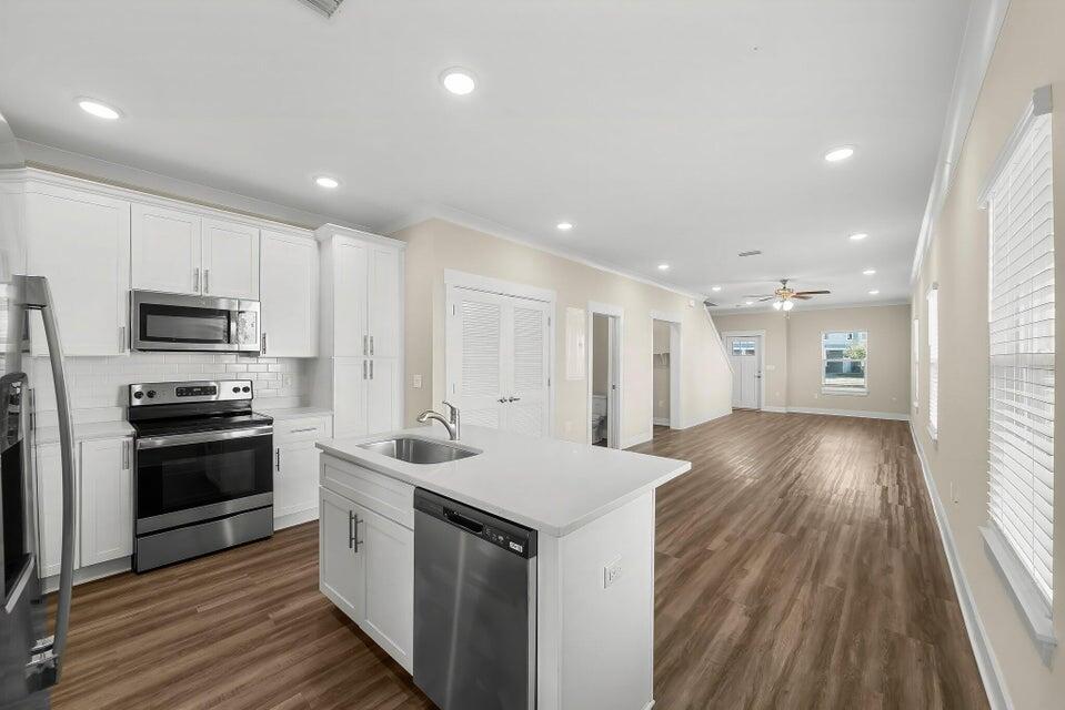 314 Date Palm Lane, Unit HORIZON Freeport, FL 32439 - Photo 2 of 25 a kitchen with stainless steel appliances granite countertop a sink stove and refrigerator