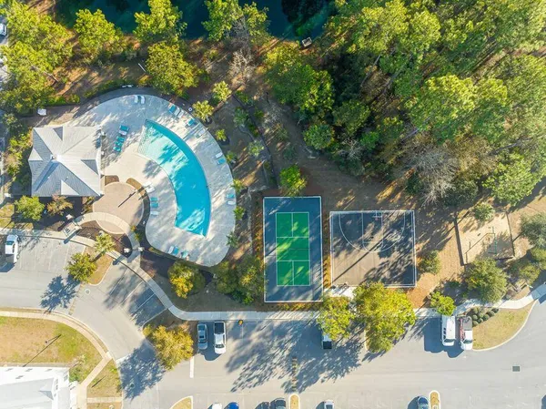 an aerial view of a house with swimming pool