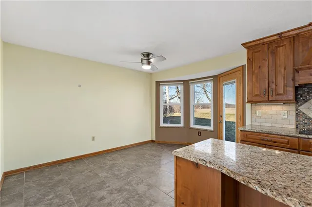 a kitchen with granite countertop sink and granite top